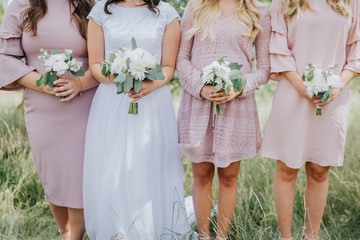 bride and bridesmaids  with flowers