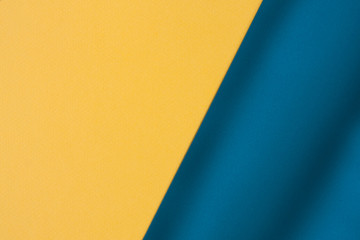 Yellow and blue color paper texture background with waves