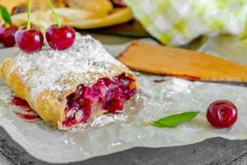 Freshly baked homemade cherry strudel.