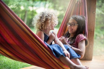 Childhood girlfriends sharing a funny moment