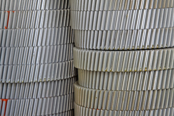 piles set metal gear in a factory warehouse