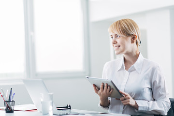 Young employee working at desk