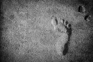 Beautiful footprints in the sand sea nature background