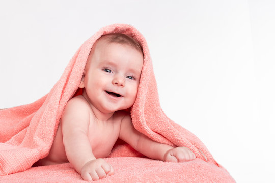 smiling  baby in a towel