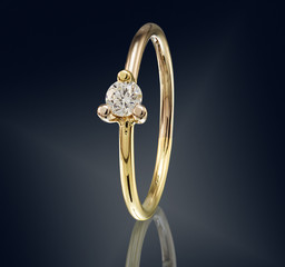 Golden ring with gemstone isolated on black background