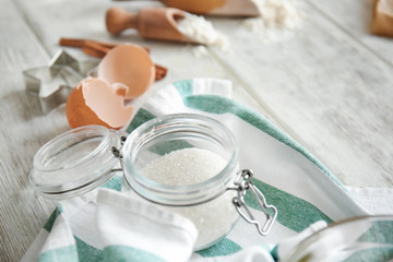 Jar with sugar on kitchen table. Bakery workshop
