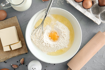 Flat lay composition with kitchen utensils and products on grey background. Bakery workshop