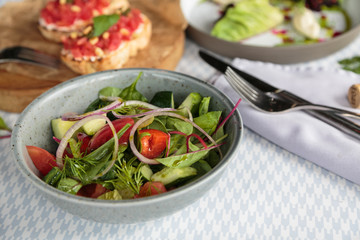 Fresh vegetable salad on table