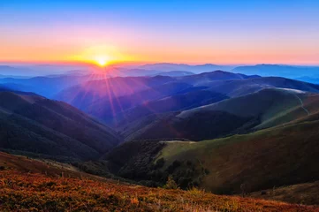 Gartenposter beautiful sunset in the mountains © Volodymyr Shevchuk