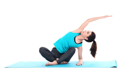 Fototapeta premium Young woman practicing yoga on white background