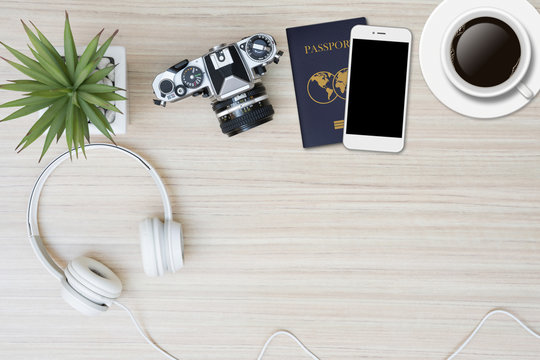 Top View Of Travel Stuff On Wood Table With Copy Space