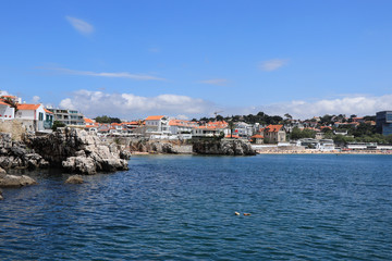 Naklejka na ściany i meble View of the beautiful Cascais bay. W|ith the town of Cascais in background in a summer day. Cascais, Portugal June 2018