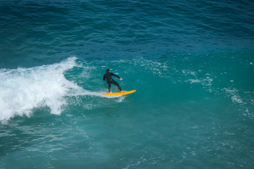 Aerial view of a surfer on a wave