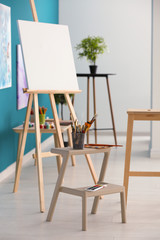 Interior of artist's workshop with canvas