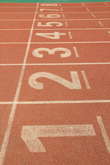 red plastic runway in a sports ground