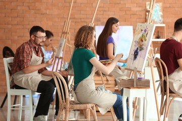 Group of people during classes in school of painters - obrazy, fototapety, plakaty