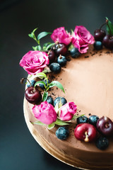 Chocolate cake with berries and flowers - french pastry