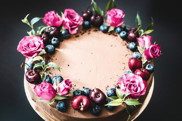 Chocolate cake with berries and flowers - french pastry