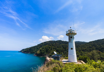 Fototapeta na wymiar The lighthouse with blue sky and daylight on Koh Lanta.