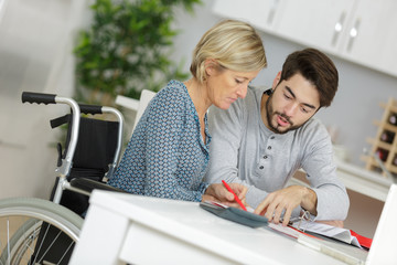 Obraz premium elder woman taken care of by young man