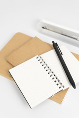 Stationery set such as Note books and Pens on white background.