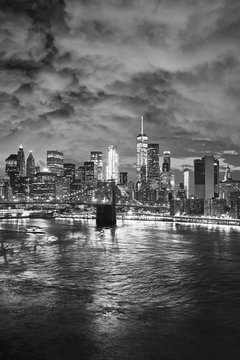 Black and white picture of New York cityscape at night, USA.