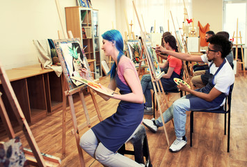 Art students painting in workshop