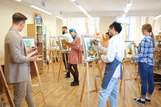 Art students painting in workshop
