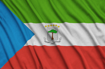 Equatorial Guinea flag  is depicted on a sports cloth fabric with many folds. Sport team banner