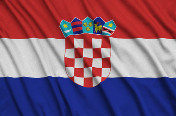 Croatia flag  is depicted on a sports cloth fabric with many folds. Sport team banner