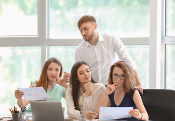 Meeting of business team working in office