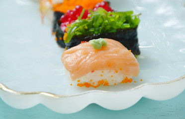 variety Sushi Japanese food with wasabi dipping soy sauce on white plate