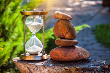 sand clock and pebble tower