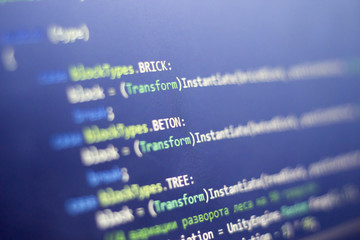 Software development C-Sharp (C#, .NET) code close up. Macro shot of game developer screen. Abstract information technology modern background.