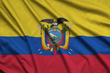 Ecuador flag  is depicted on a sports cloth fabric with many folds. Sport team banner