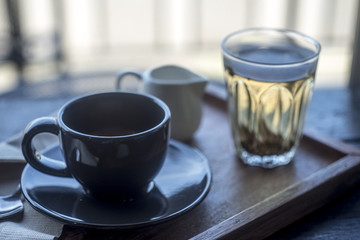 The espresso coffee and hot tea on tray