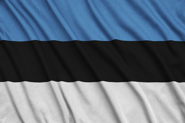 Estonia flag  is depicted on a sports cloth fabric with many folds. Sport team banner