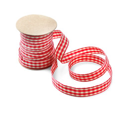 Bobbin with ribbon for scrapbooking on white background