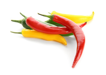Different chili peppers on white background