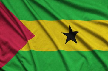 Sao Tome and Principe flag  is depicted on a sports cloth fabric with many folds. Sport team banner