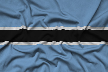 Botswana flag  is depicted on a sports cloth fabric with many folds. Sport team banner