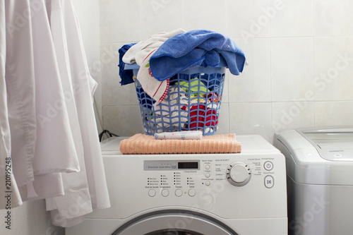 Little Laundry Area In A Domestic House There Are Two Clean White Little Laundry Area In A Domestic House There Are Two Clean White Shirts Hanged At