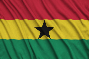 Ghana flag  is depicted on a sports cloth fabric with many folds. Sport team banner