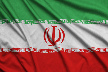 Iran flag  is depicted on a sports cloth fabric with many folds. Sport team banner