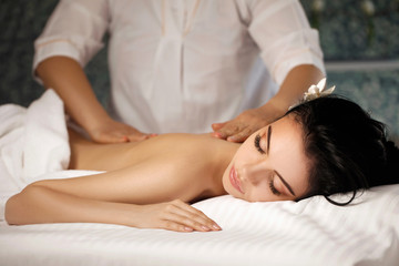 Fototapeta na wymiar Relaxed woman receiving massage