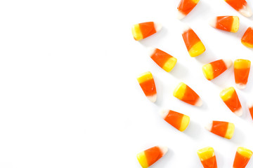 Typical halloween candy corn isolated on white background. Copyspace - obrazy, fototapety, plakaty