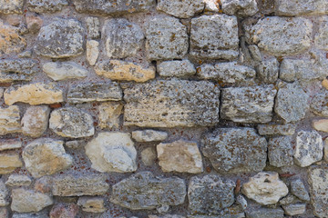 Texture of a stone antique wall, background