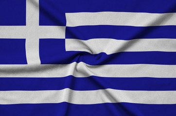 Greece flag  is depicted on a sports cloth fabric with many folds. Sport team banner