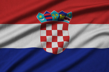 Croatia flag  is depicted on a sports cloth fabric with many folds. Sport team banner