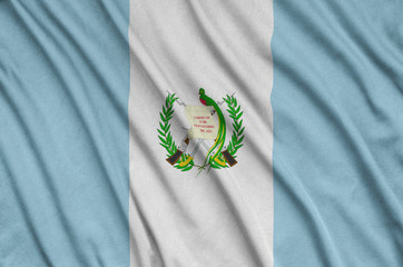Guatemala flag  is depicted on a sports cloth fabric with many folds. Sport team banner
